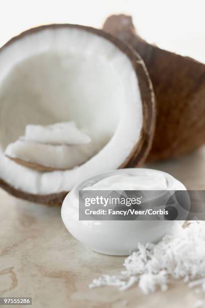 coconut and jar of lotion - coconut shaving stock pictures, royalty-free photos & images