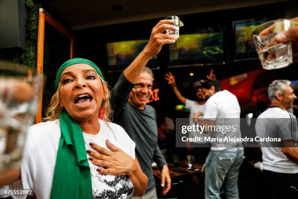 Mandy Molesten, left, cheers with a shot of tequila after the finale of the Iranian v Morocco game of the World Cup.