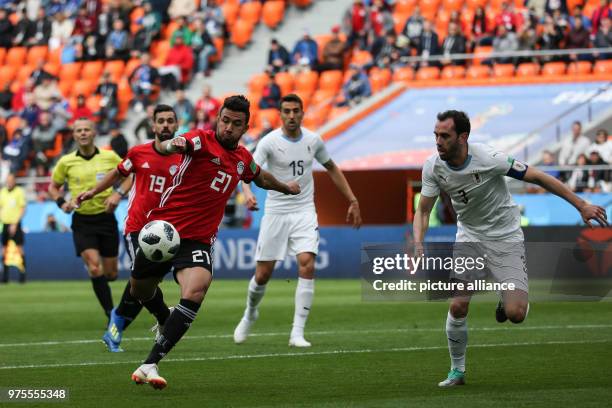 Egypt's Mahmoud Hassan 'Trezeguet' shoots on goal during the FIFA World Cup 2018 Group A soccer match between Egypt and Uruguay at the Ekaterinburg...