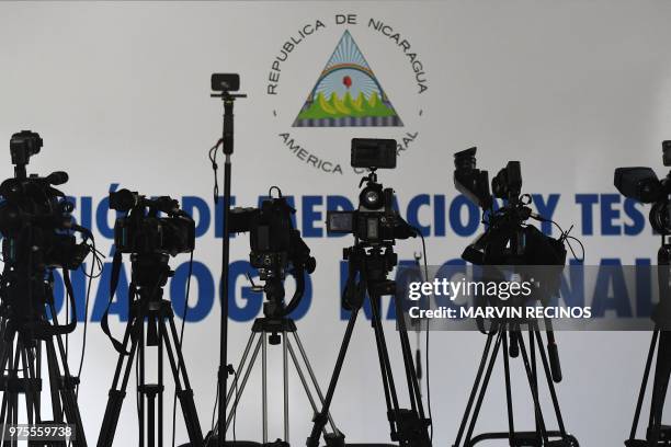 Cameras are set up in the conference room of the "Our Lady of Fatima" inter-diocesan seminary, where journalists wait for reactions from the...