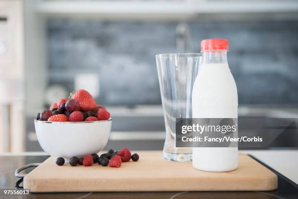 bowl of fruit and milk - strawberry milkshake and nobody stock pictures, royalty-free photos & images