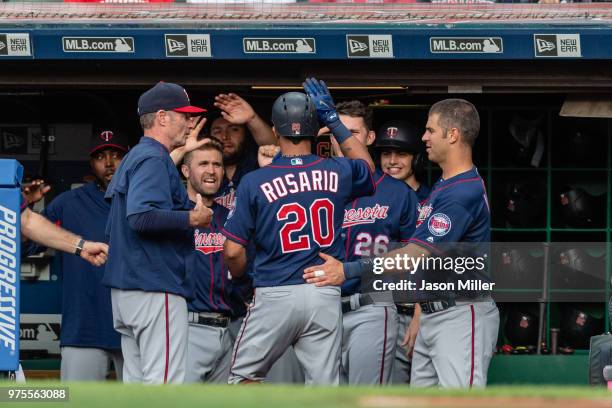 Manager Paul Molitor nd Joe Mauer celebrate with Eddie Rosario of the Minnesota Twins after Rosario hit a solo home run during the first inning...