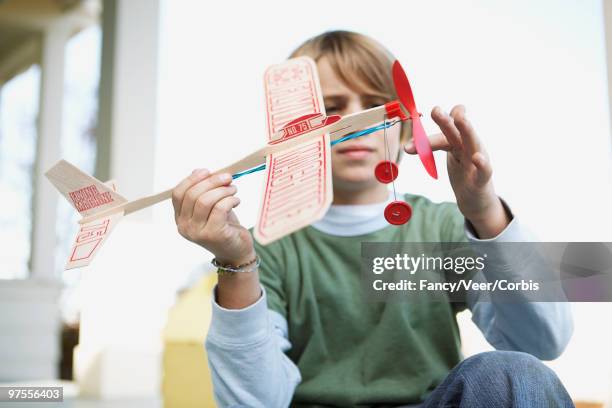 boy with a toy airplane - living legends of aviation stock pictures, royalty-free photos & images