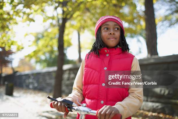 girl riding scooter - children only braided ponytail stock pictures, royalty-free photos & images