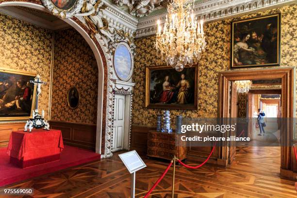 May 2018, Germany, Gotha: A cross is on a table in the bed and dressing room inside the North wing of Friedenstein Palace. Friedenstein Palace is one...