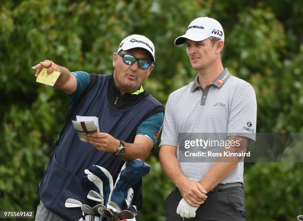 Justin Rose of England talks with his caddie Mark Fulcher on the 15th tee during the second round of the 2018 U.S. Open at Shinnecock Hills Golf Club...