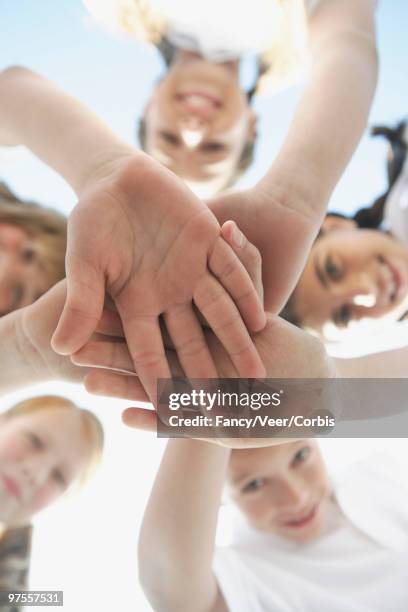 classmates in a huddle - climat stock pictures, royalty-free photos & images