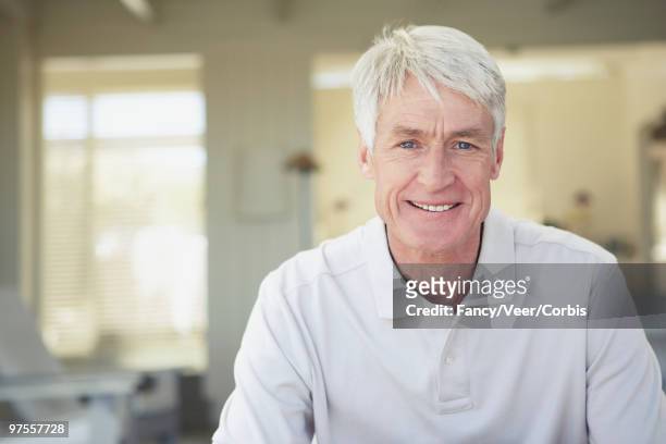 senior man smiling - adirondack chair closeup stock pictures, royalty-free photos & images