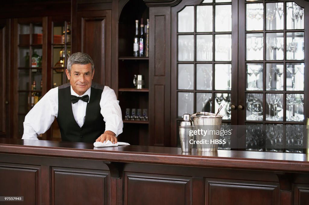Bartender wiping counter