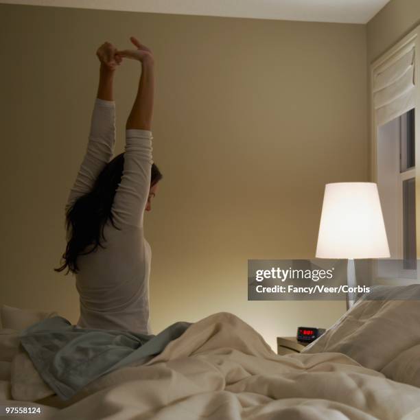 woman stretching - suite photos et images de collection