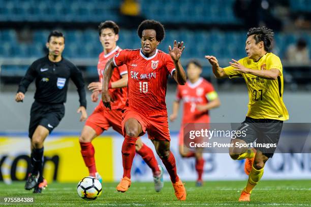 Jeju FC Forward Magno Cruz in action against Guangzhou Midfielder Zheng Long during the AFC Champions League 2018 Group Stage G Match Day 4 between...