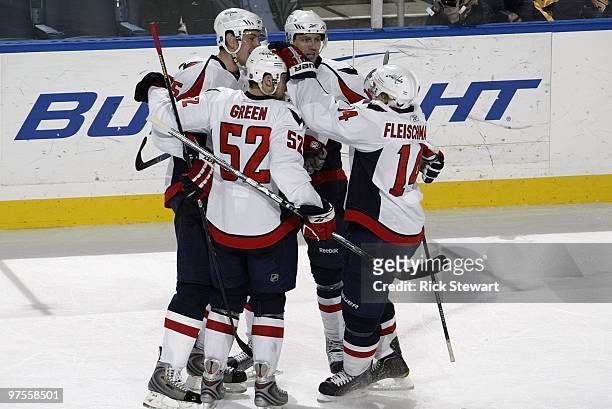 Jeff Schultz, Mike Green, Eric Fehr and Tomas Fleischmann of the Washington Capitals celebrate a goal during the game against the Buffalo Sabres at...