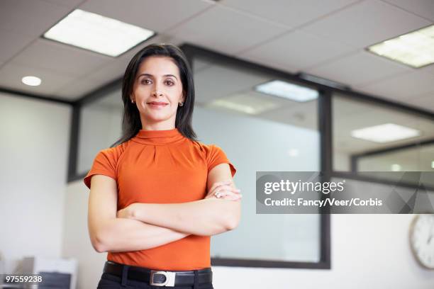 confident businesswoman - blusa cor de laranja imagens e fotografias de stock