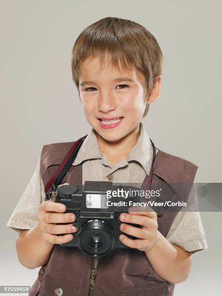 boy holding a camera - draft media opportunity stock-fotos und bilder