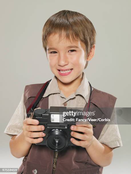 boy holding a camera - draft media opportunity stock pictures, royalty-free photos & images