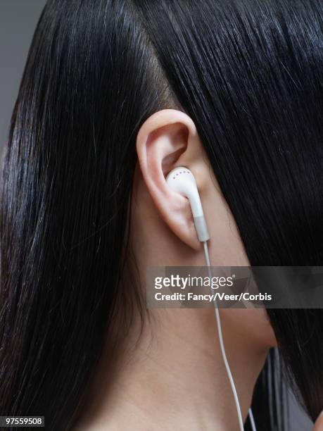 woman with long hair parted around ear - arts express yourself 2009 stock pictures, royalty-free photos & images