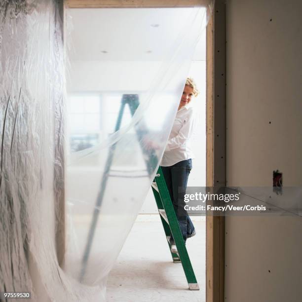 woman on ladder - opaque stock pictures, royalty-free photos & images