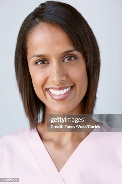 nurse smiling - nurse and portrait and white background and smiling and female and looking at camera stock pictures, royalty-free photos & images