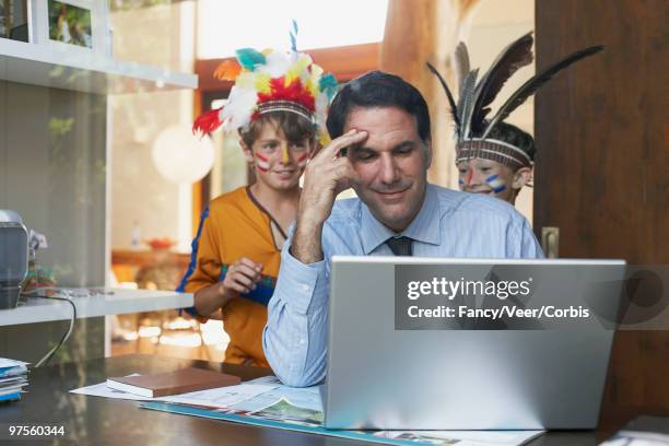 boys sneaking up on father - interruptor stock pictures, royalty-free photos & images