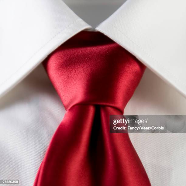 red silk necktie over white dress shirt - fashion design minimalist edgy stock pictures, royalty-free photos & images