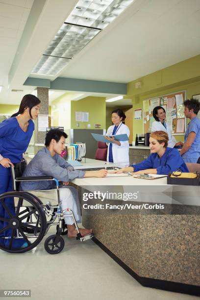 hospital reception desk - white coat fashion item stock pictures, royalty-free photos & images