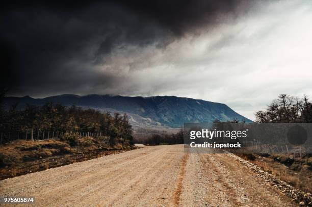 heavy storm clouds in patagonia, argentina - argentina dirt road panorama stock pictures, royalty-free photos & images