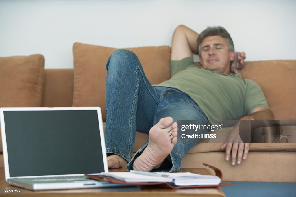 Man Napping On Couch High-Res Stock Photo - Getty Images