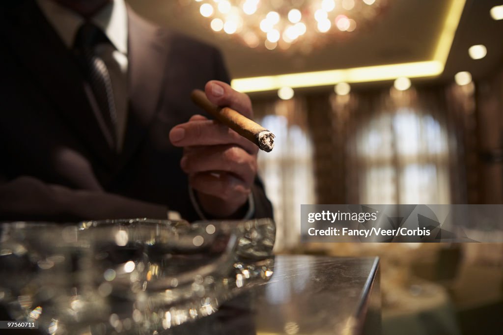 Man holding cigar