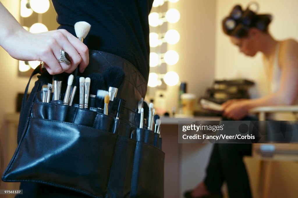 Performer and makeup artist in a dressing room