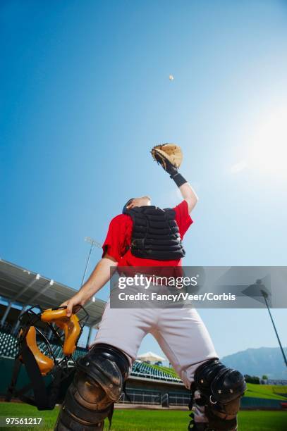 catcher catching baseball - baseball catcher ストックフォトと画像