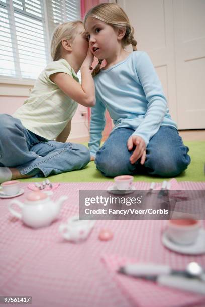 girls whispering at a tea party - children only braided ponytail stock pictures, royalty-free photos & images