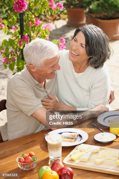 couple enjoying breakfast outdoors - butter dish stock pictures, royalty-free photos & images