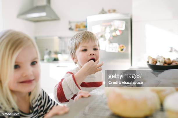 happy nordic children playing with dough - flour sifter stock pictures, royalty-free photos & images