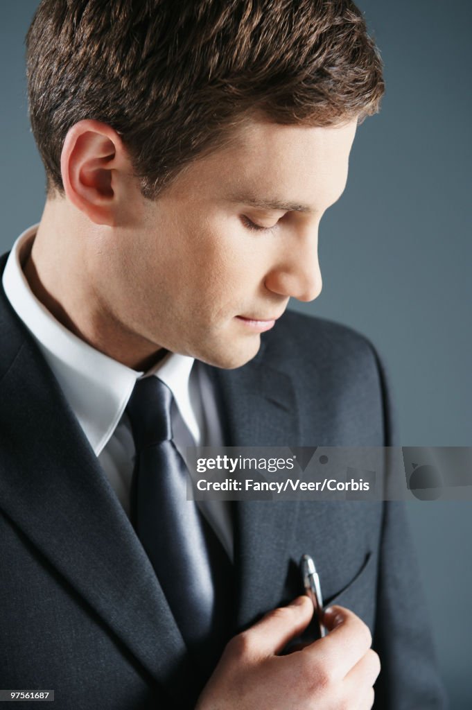 Businessman with pen in pocket