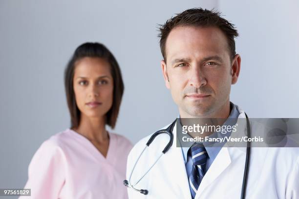 doctor and nurse - white coat fashion item stock pictures, royalty-free photos & images