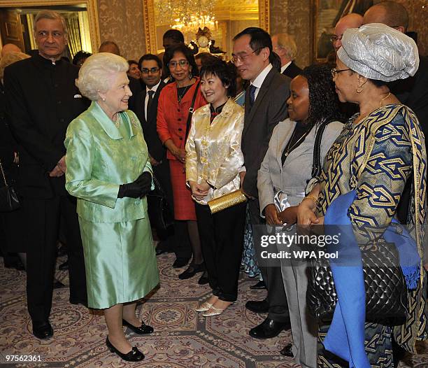 Queen Elizabeth II and Commonwealth Secretary General Kamalesh Sharma meet guests at the Commonwealth Day Reception at Marlborough House on March 08,...