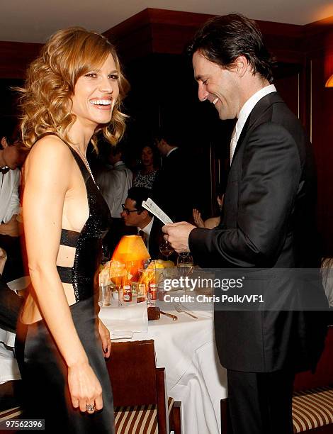 Actors Hilary Swank and Jon Hamm attend the 2010 Vanity Fair Oscar Party hosted by Graydon Carter at the Sunset Tower Hotel on March 7, 2010 in West...