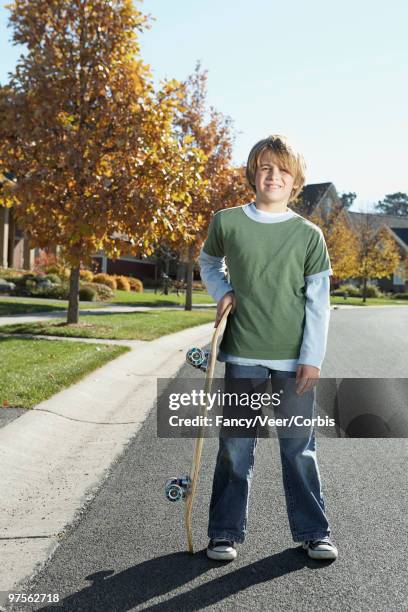 boy with a skateboard - skater boy hair stock pictures, royalty-free photos & images