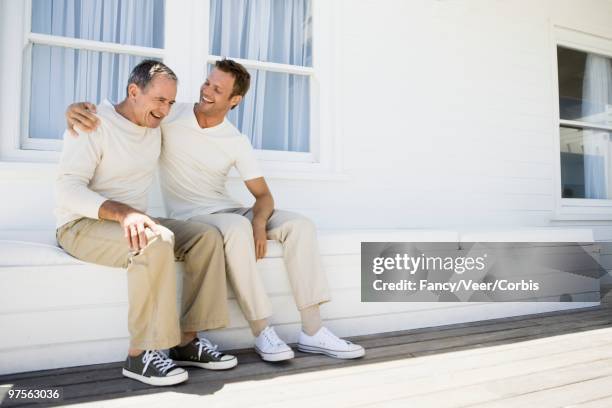 father and son - next to stock pictures, royalty-free photos & images
