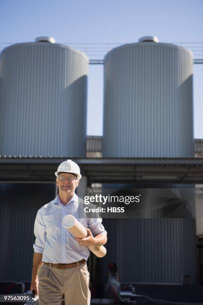 foreman holding blueprints - luggage hold stock pictures, royalty-free photos & images