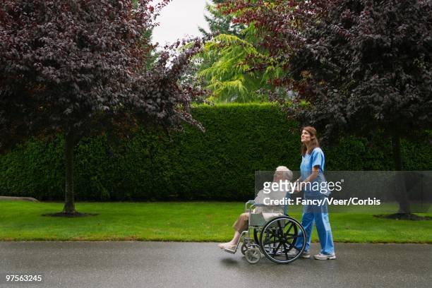 nurse and patient - retirement community building stock pictures, royalty-free photos & images