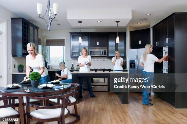 woman busy in kitchen - multiple images of the same woman stock pictures, royalty-free photos & images