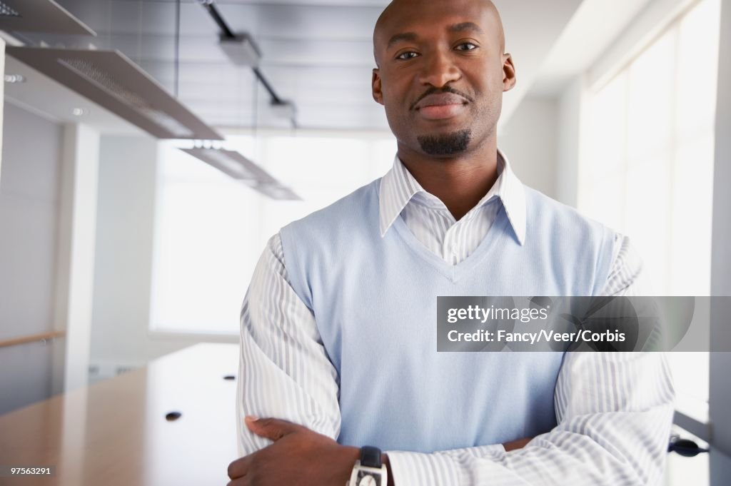Confident Businessman with Arms Crossed