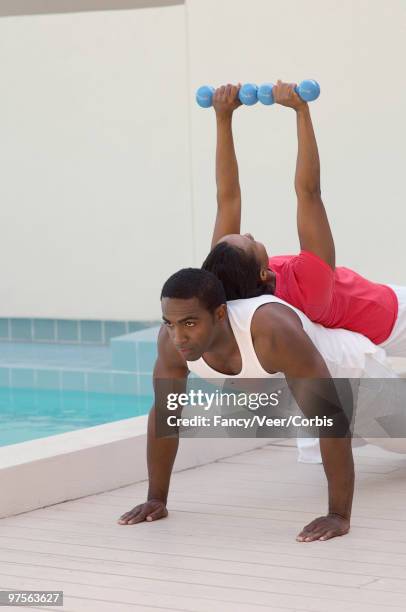 couple working out together - ウェイト階級 ストックフォトと画像