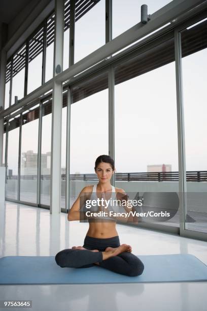 woman doing yoga - young urban professional person stock-fotos und bilder
