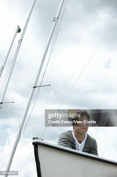 man on a boat - nautical structure stock pictures, royalty-free photos & images