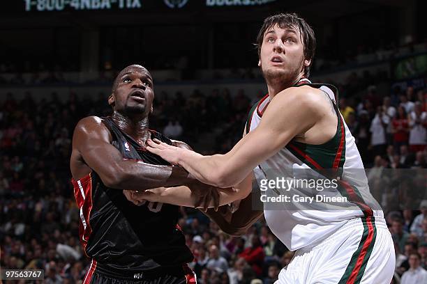 Joel Anthony of the Miami Heat and Andrew Bogut of the Milwaukee Bucks look for the rebound during the game on January 30, 2010 at the Bradley Center...