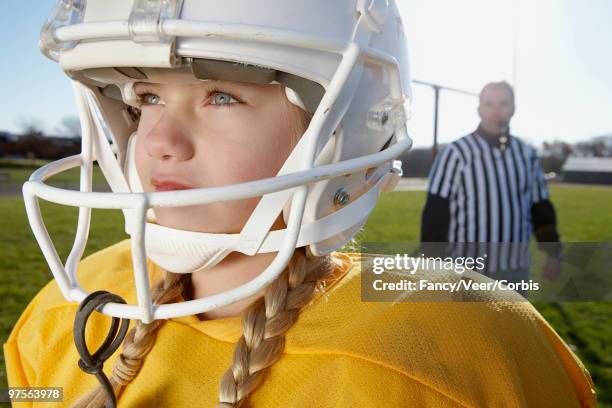 girl playing football, referee in background - girl referee stock pictures, royalty-free photos & images