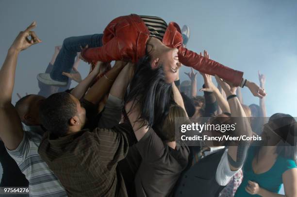 crowd surfing - crowd surfing stock pictures, royalty-free photos & images