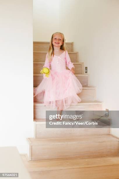 young girl walking down a staircase - kid looking down stock pictures, royalty-free photos & images